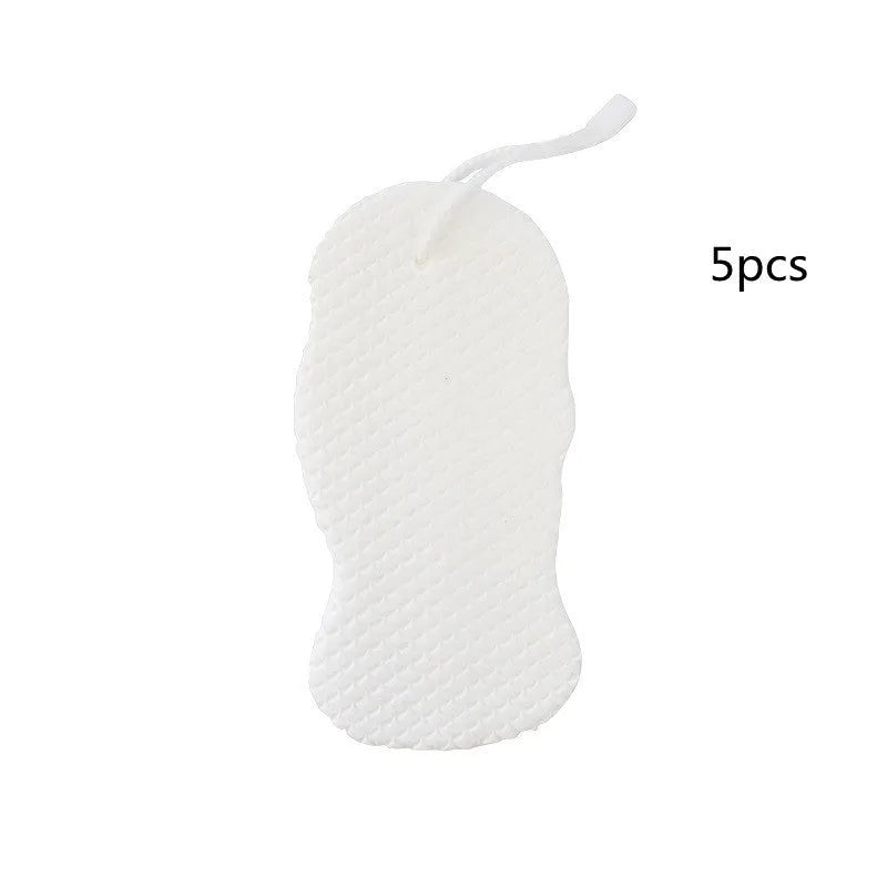 3D fish scale pattern bath sponge ball in assorted colours on a bathroom background.