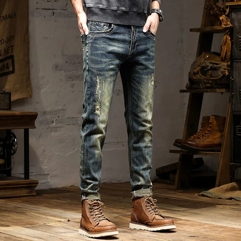 Men's skinny fit jeans in a retro colour with a zip fly, shown laid flat.