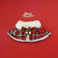 Red polyester pet scarf with snowflake bell design tied around a dog's neck for Christmas