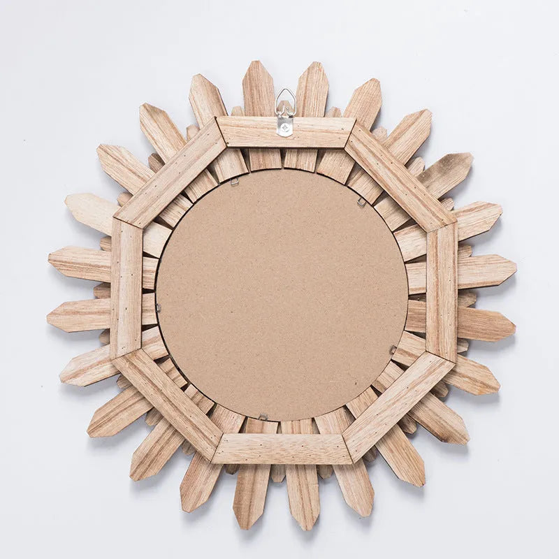 Circular wooden hanging mirror with a baked colour finish on a plain wall.