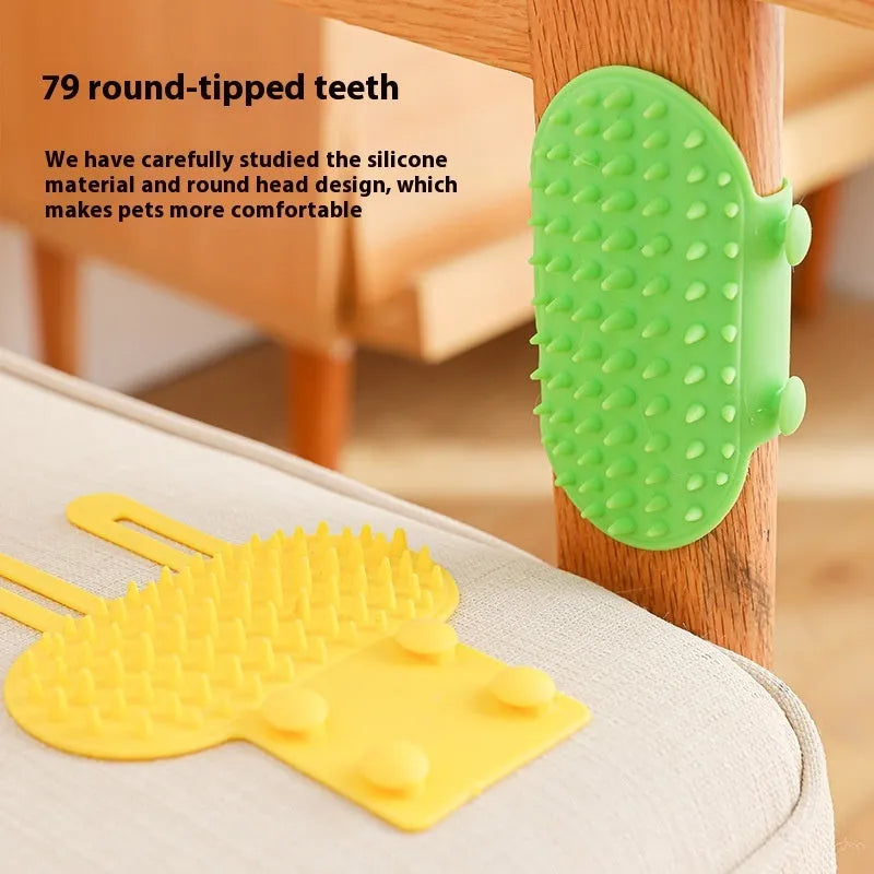 Silicone cat grooming brush with comb teeth mounted on table leg for scratching and hair removal