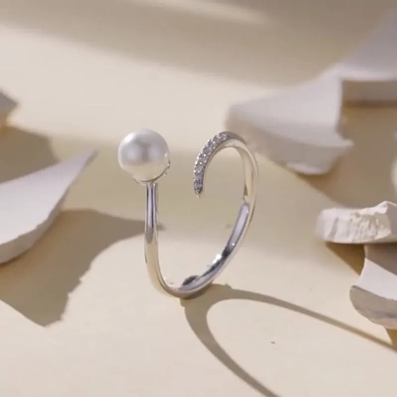 Sterling silver adjustable ring with genuine freshwater shell pearl on minimalist band