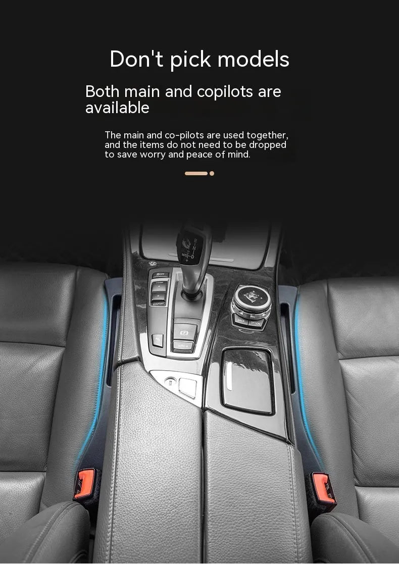 Black plastic car seats gap storage box with handle between driver seat and centre console