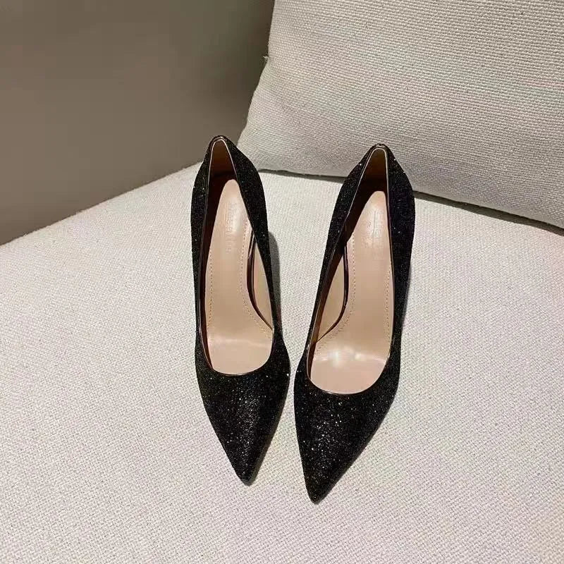 Women's silver PU leather bridal shoe with crystal embellishment on a 9cm stiletto heel.