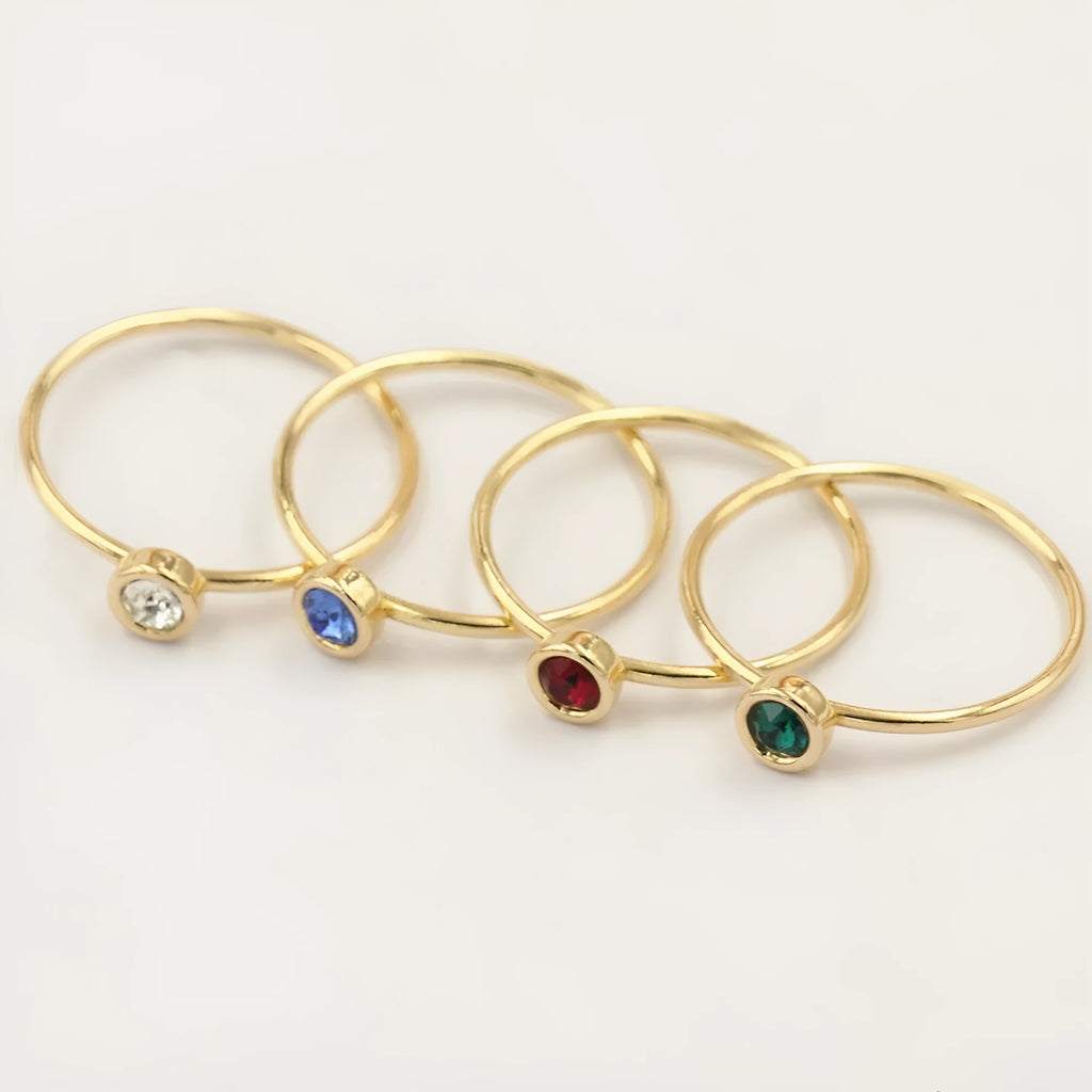 Women's 14K gilded copper knuckle ring with green cubic zirconia stone in US size 7.