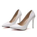 Women's nude stiletto heel pointed pumps in apricot colour with a buckle detail and rubber sole.