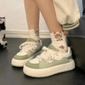 Green women's casual shoes with flat heel and round toe featuring mesh lining