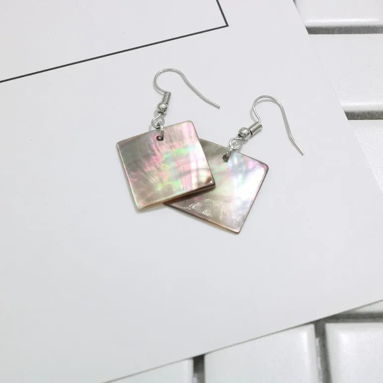Geometric drop earrings made from natural shell in Square Panther or Rectangular Shell colour options.