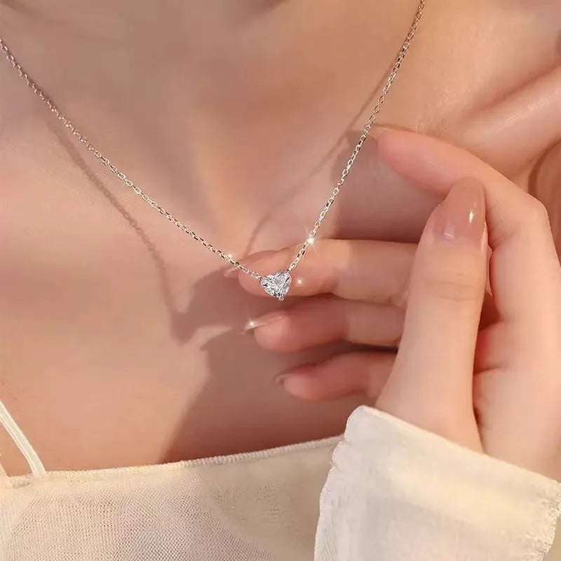 Women's silver colour heart pendant necklace on copper chain, minimalist jewellery design