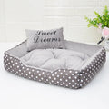 Polka dot print square dog bed with a matching removable embroidered pillow in a choice of four colours.