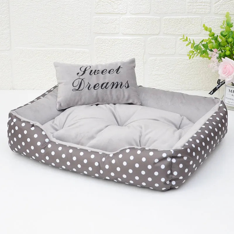Polka dot print square dog bed with a matching removable embroidered pillow in a choice of four colours.