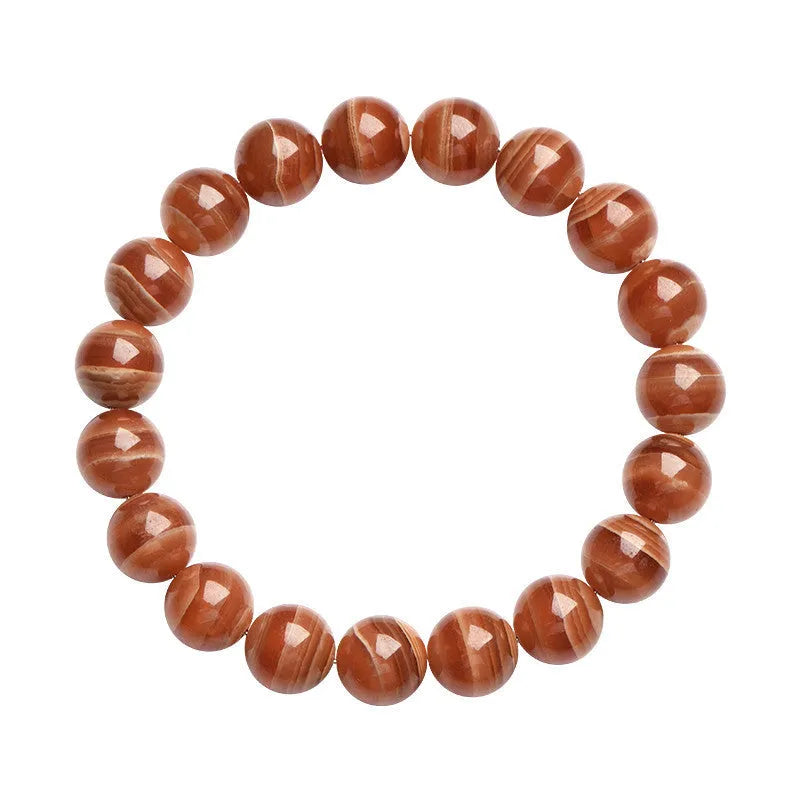Natural Old Mine rhodochrosite mineral bracelet with round manganese spar beads in geometric design.
