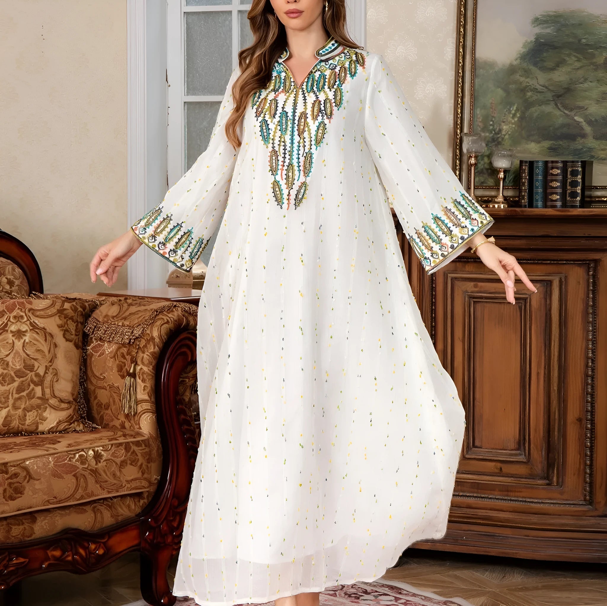 White long sleeve Arabic robe for women, Dubai style, with full-length skirt.
