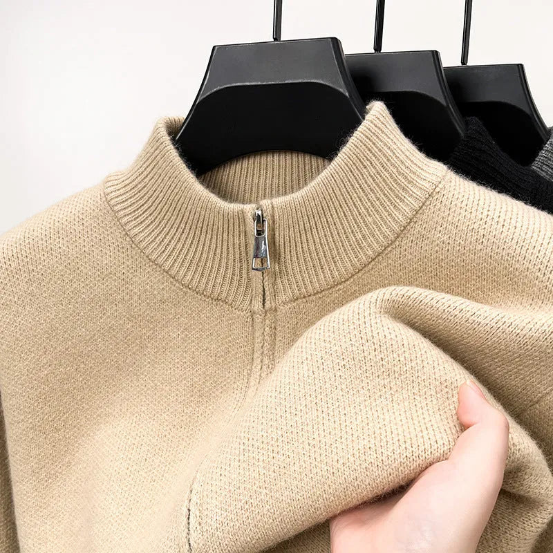 Men's black knitted zip-up cardigan with a stand collar and loose fit.