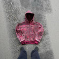 Blue loose fit men's hooded zip coat with front zip and long sleeves on a hanger.