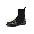 Women's black low heel Martin boots with round toe, belt buckle stitching, and lace-up front.