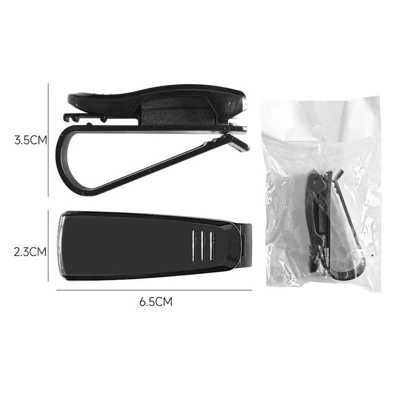 Black plastic car sunshade clip holder for glasses and tickets on a car visor