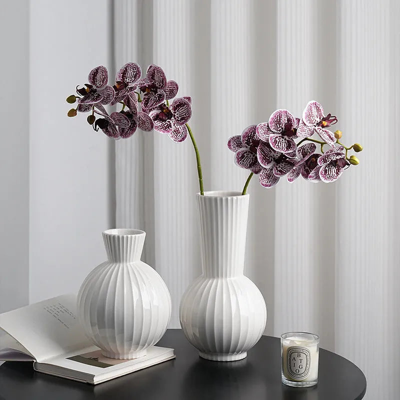 American country style ceramic vase with white base and blue stripes on living room table