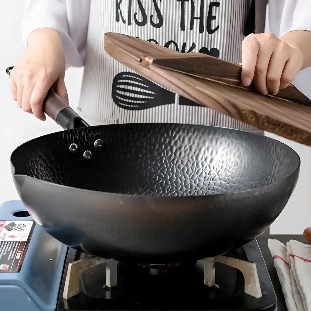 Black handmade traditional iron wok with wooden handle, 32cm diameter with lid.