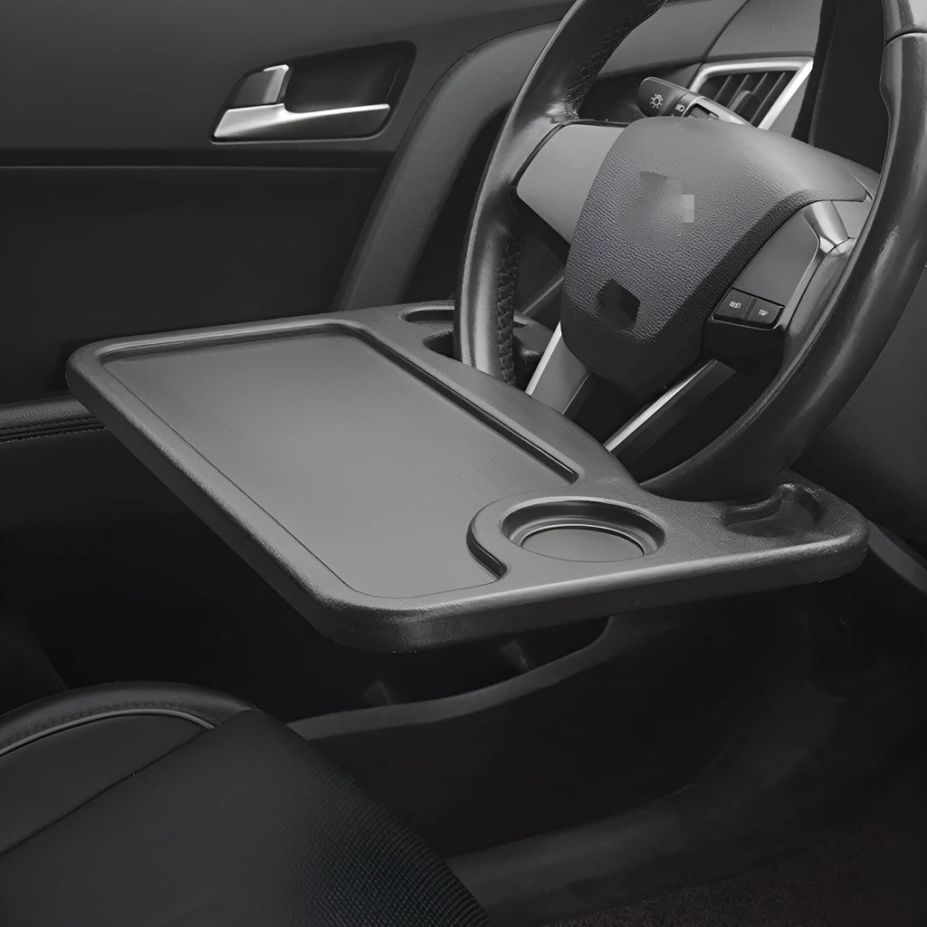 Black plastic car desk with computer workspace and integrated plate storage compartments