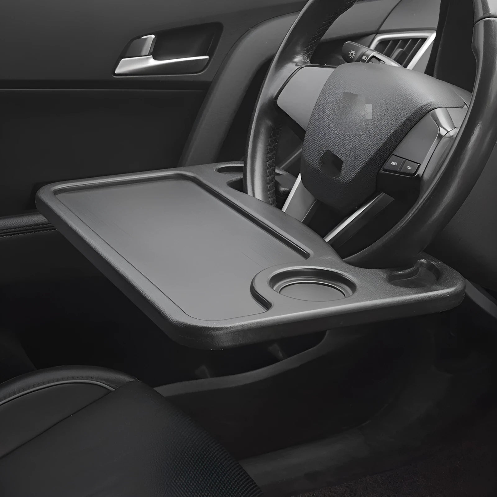 Black plastic car desk with computer workspace and integrated plate storage compartments
