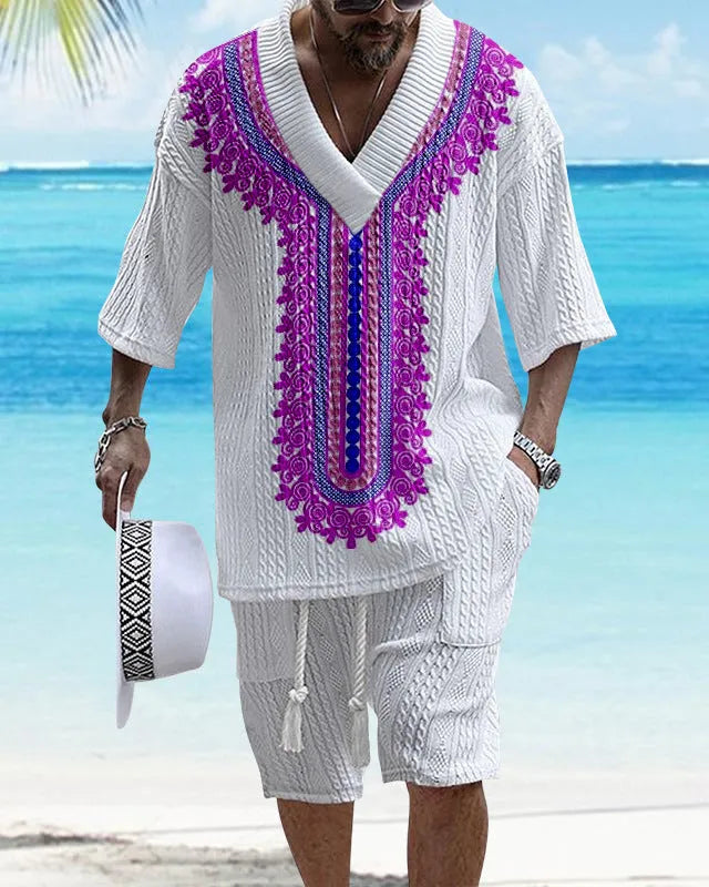 Man wearing a printed drop-shoulder knitted short-sleeve top with matching shorts, a casual loungewear set.