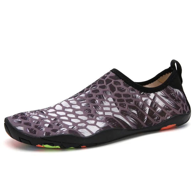 A pair of quick-dry beach wading shoes in camouflage print, showing the Lycra elastic upper and EVA midsole.