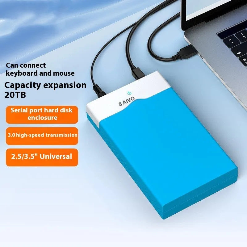 Black and silver 3.5 inch USB SATA hard drive enclosure with power supply and cable on a desk.