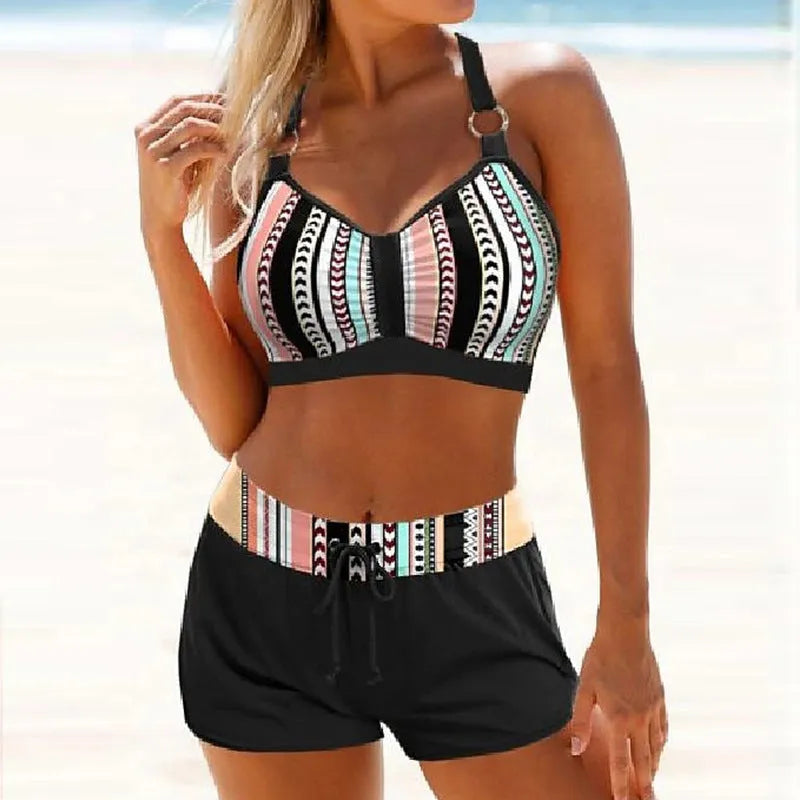Women's two-piece polyester bikini swimsuit in a print pattern, shown on a mannequin.