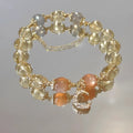 Chinese style women's crystal bracelet with a citrine moonstone and 14K gold electroplating.
