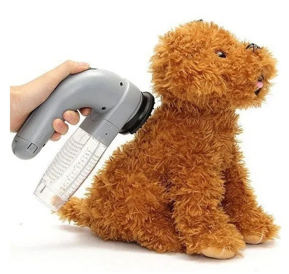Gray handheld electric pet hair vacuum cleaner with rubber grooming head.