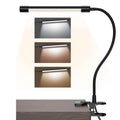 Black and white LED desk lamp with USB cable and 26cm long light bar on a desk.