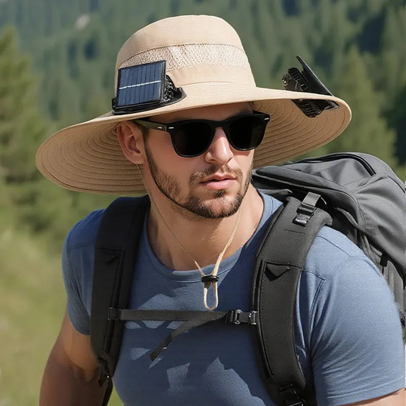 Man wearing a beige solar-powered fan hat with a neck flap outdoors.