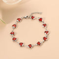 Devil's Eye Creative stainless steel geometric heart bracelet in an electroplated colour on a wrist.