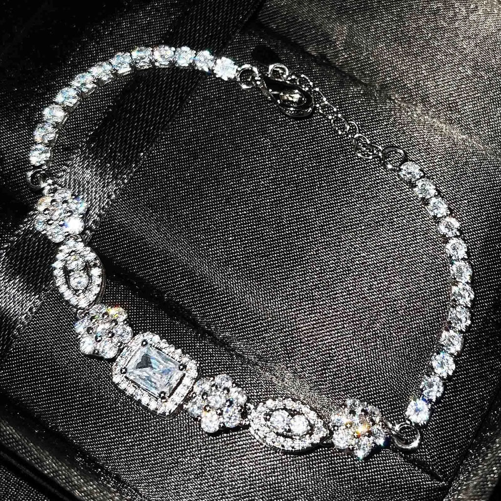 Women's geometric zircon bracelet with silver and white gold plating.