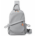 Men's black waterproof polyester crossbody bag worn across the body