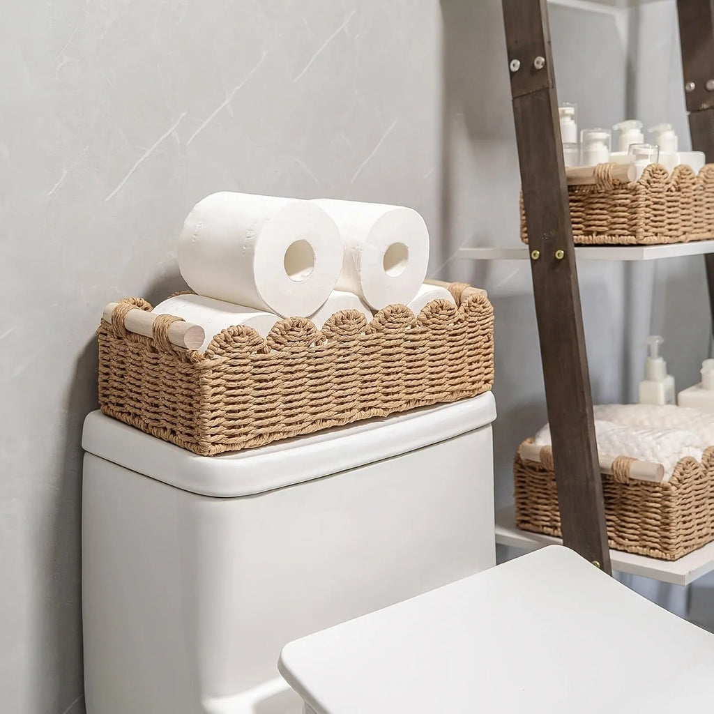 Rectangular woven paper storage basket in a neutral colour on a wooden desktop