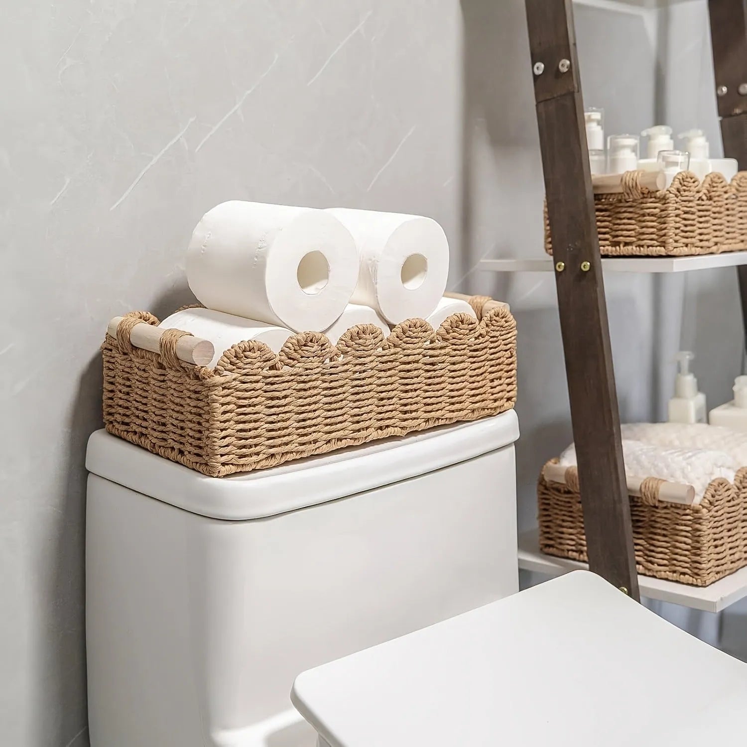 Rectangular woven paper storage basket in a neutral colour on a wooden desktop