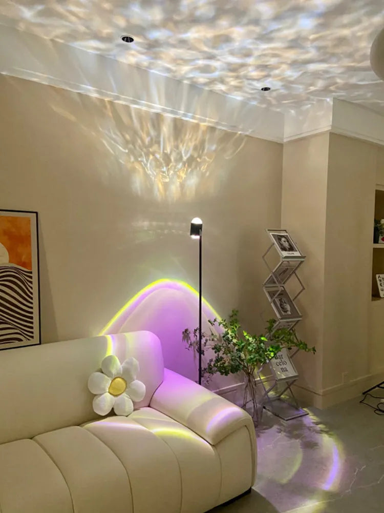 Sunset red floor lamp projecting a water wave light pattern onto a wall in a modern room.