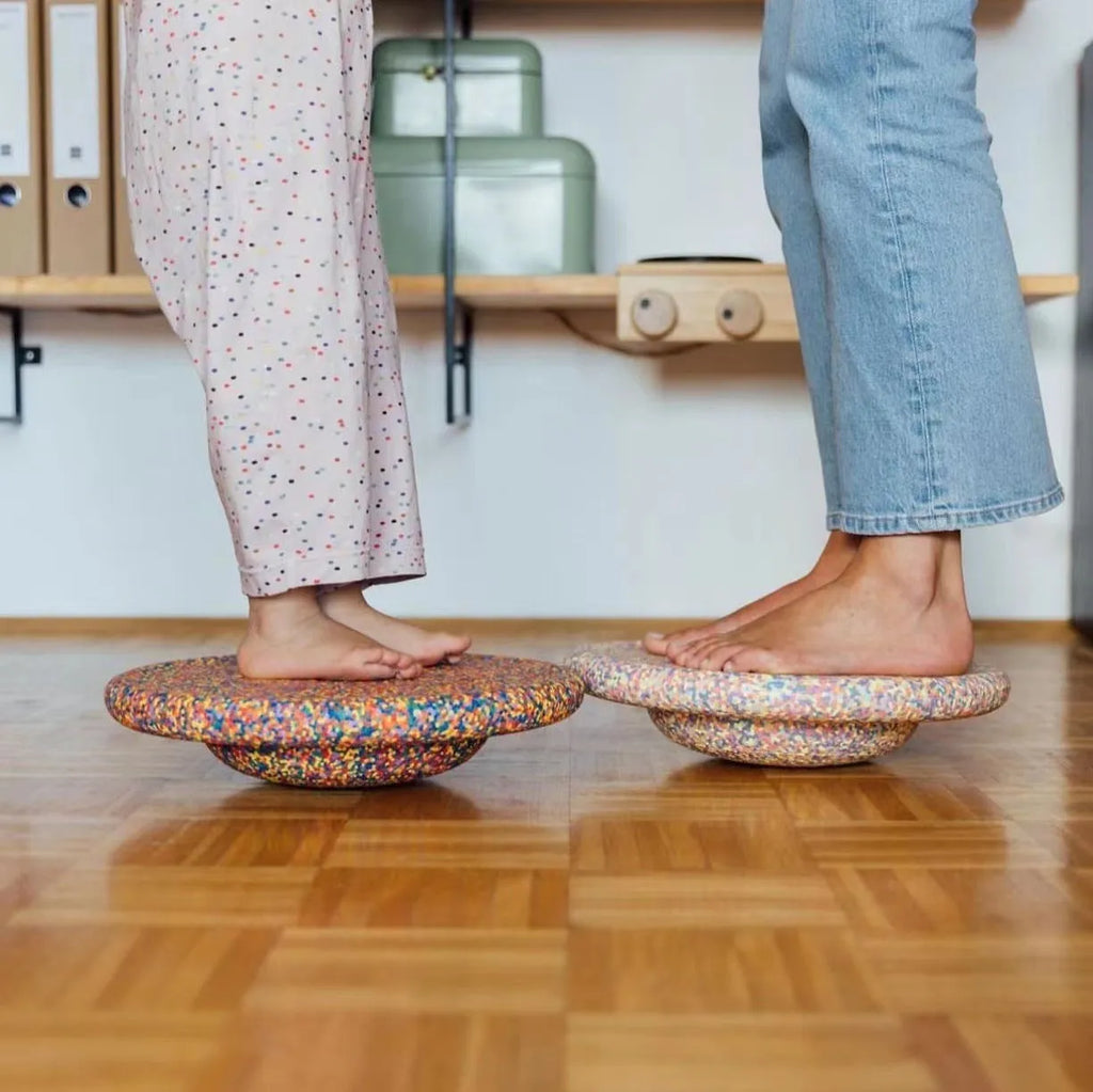 Plastic wood surf balance board for children in mixed colour or black wood effect finish.