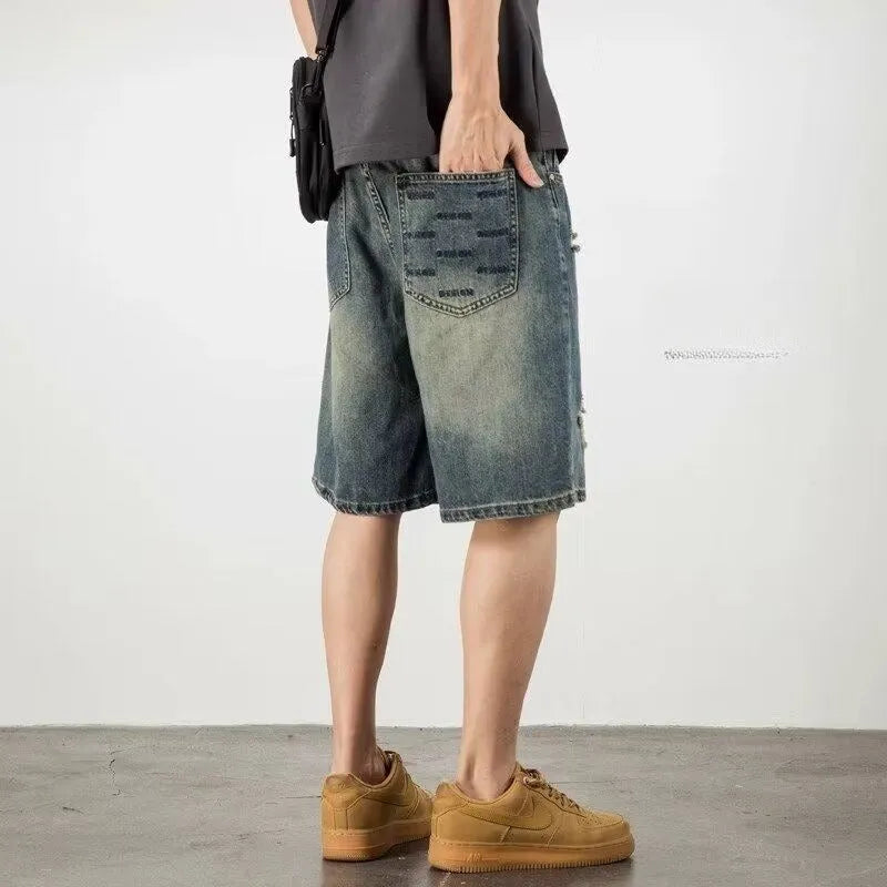 Men's blue denim shorts with retro loose hole design and straight cut