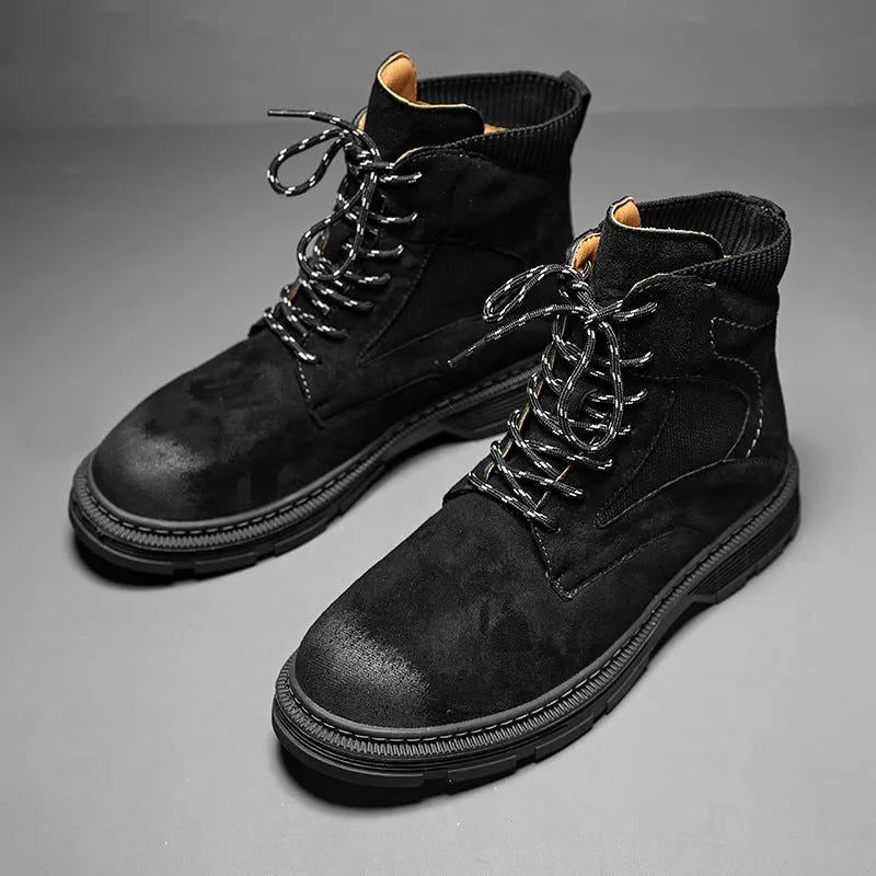 Men's vintage brown Martin ankle boots with round toe and thick low heel on a plain background.