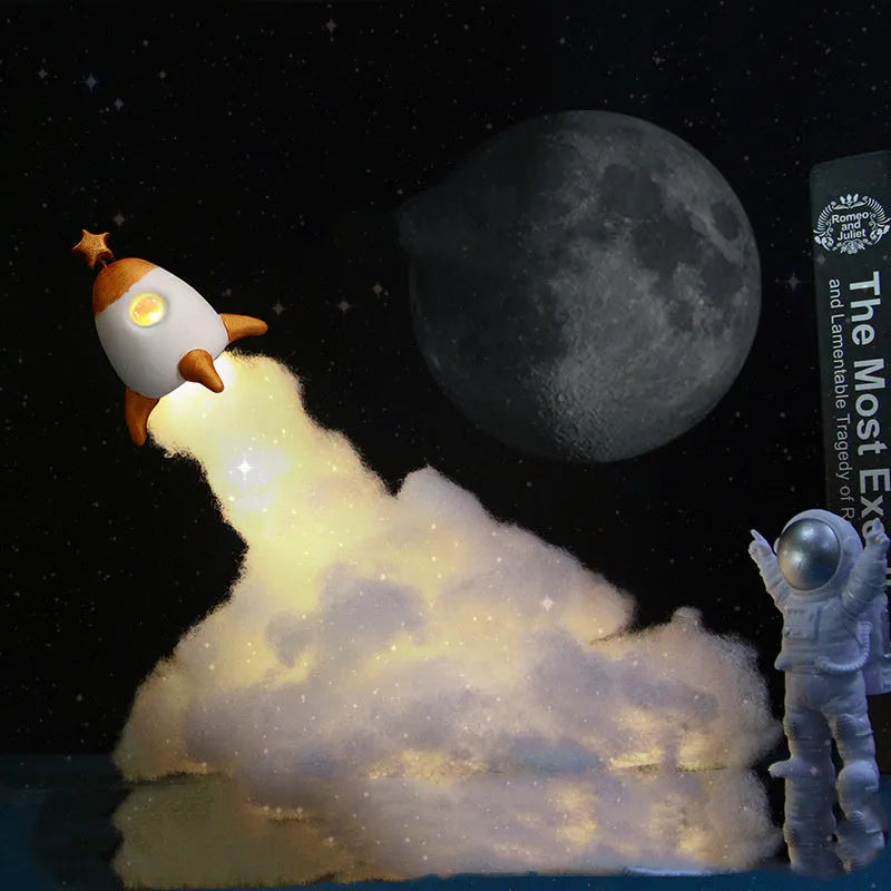 DIY astronaut rocket night light kit parts including plastic rocket, LED string, straws, and 19cm base