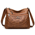 Soft leather women's shoulder bag in horizontal square design with crossbody strap