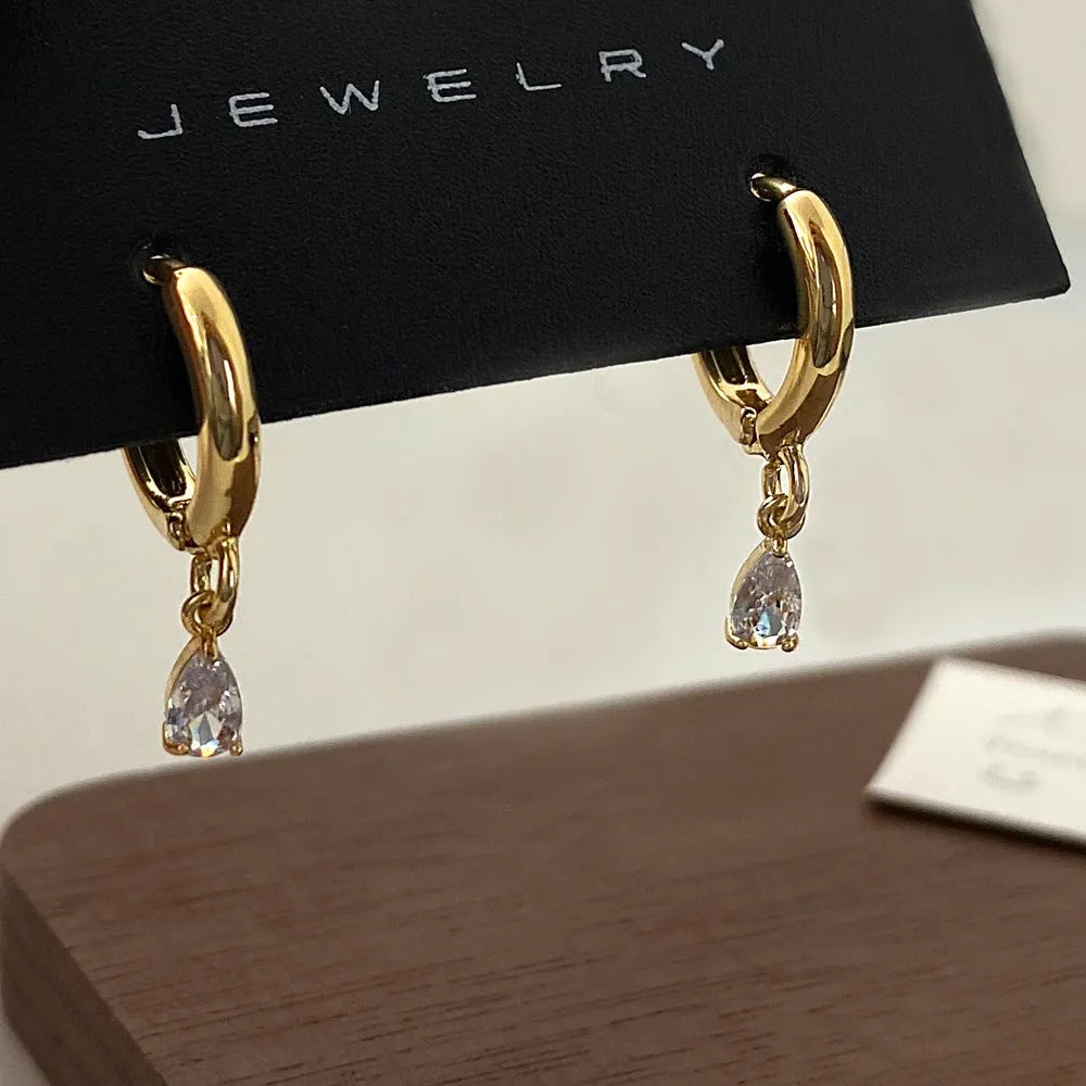 Zircon jewellery set with geometric necklace, matching earrings, and anklet featuring meteor shower design