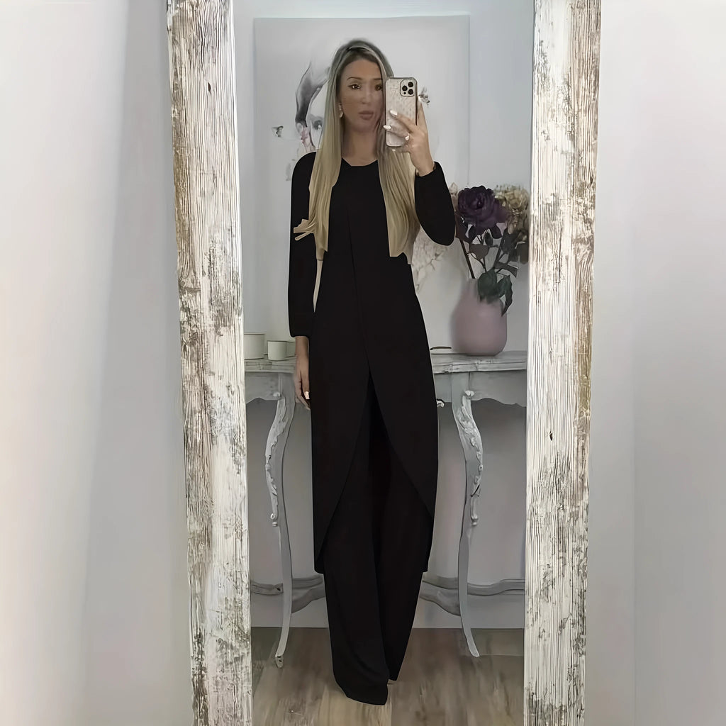 Black casual polyester two-piece tracksuit with long sleeves and trousers on a hanger