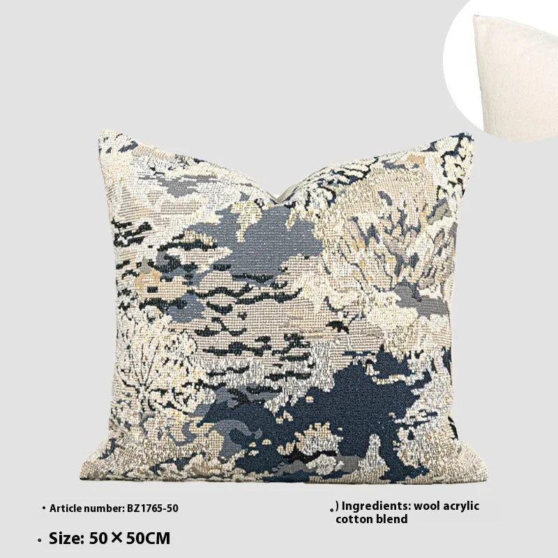 Blue floral pattern decorative pillow with feather velvet fill in wool blend cover.