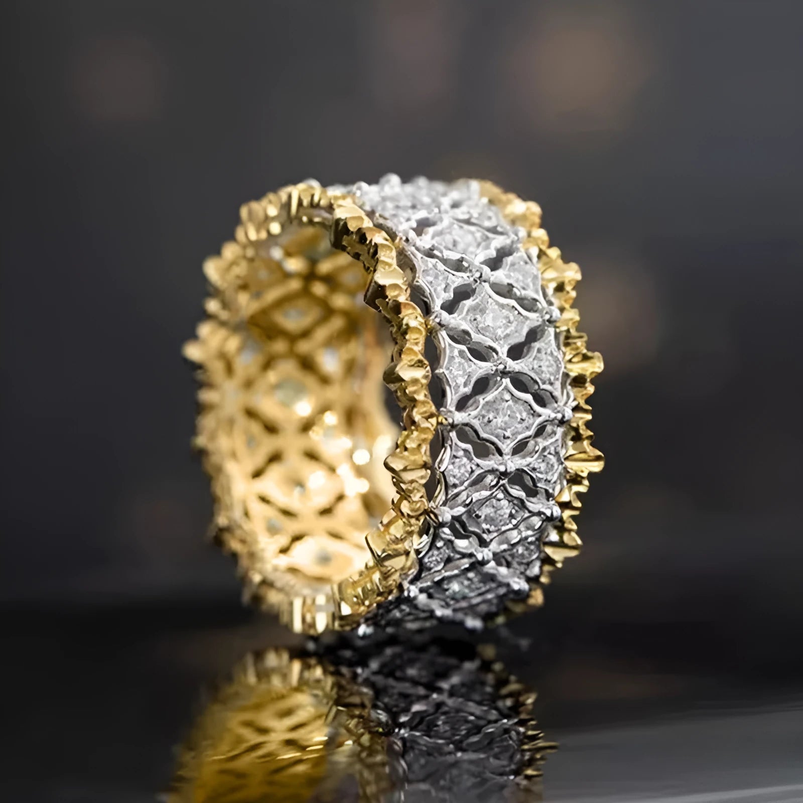 Geometric two-tone gold zircon fashion ring on a white background, showing its angular shape and round details.