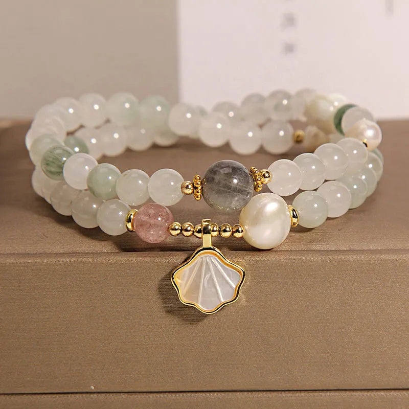 Crystal bracelet with gold-plated artificial gemstone inlay and Tianshan Jade shell ginkgo leaf pendant