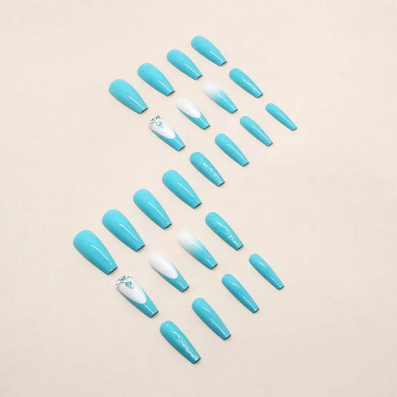 Long ballet shape press-on nails with smart blue diamond glitter pattern and glue
